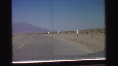Lake Tahoe California (1969): Driving Along Road Travelling A Long Way Passing One