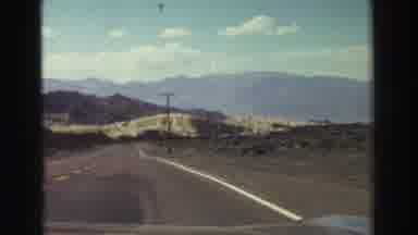 Lake Tahoe California (1969): Driving Down A Back Road Along The Mountains And The