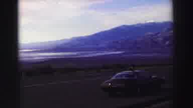 Lake Tahoe California (1969): Scenic View Of Nature And A Car Parked In The Middle
