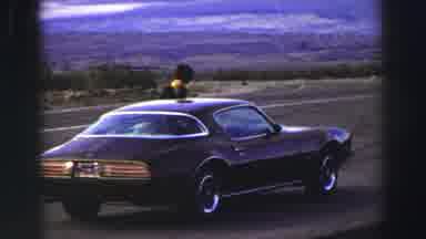 Lake Tahoe California (1969): Person Wiping Inside Of Windshield With Towel Of