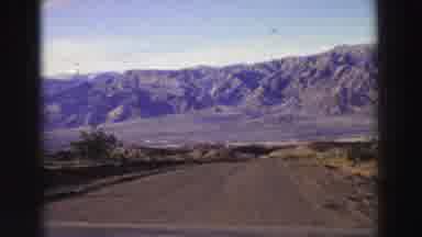 Lake Tahoe California-1969: Mountain Road Drive With Purple-Hued Peaks