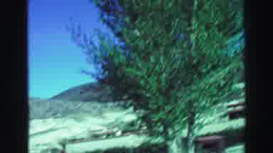 Lake Tahoe California (1969): Driving Through Dry Mountains Entering A Settlement