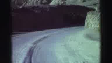 Lake Tahoe California (1969): Driving Through A Desert Mountain Road On A Sunny