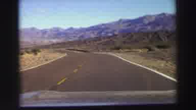 Lake Tahoe California (1969): Driving On A Road In The Middle Of A Deserted