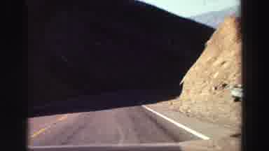 Lake Tahoe California (1969): Driving Next To A Desert Mountain Range