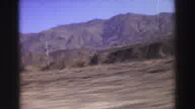 Lake Tahoe California (1969): Sliding View Of Open Land With Mountains In The
