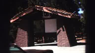Lake Tahoe California (1969): Campsite With A Brown Car And Lots Of Green Trees In