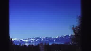 Lake Tahoe California (1969): Beautiful Snow Capped Mountains Are Seen In The