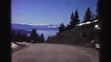 Lake Tahoe California (1969): Driving Down A Dirt Road With Mountain Scenery Then