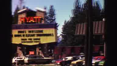 Lake Tahoe California (1969): Hotel Full With Cars Many Tall Trees And Clear Skies