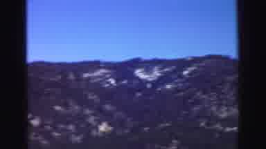 Lake Tahoe California (1969): Scenic View Of Mountains In The Distance Filmed From