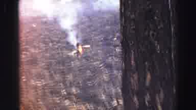 Lake Tahoe California (1969): Smoke Coming Out Of The Mountain With A Fire In A