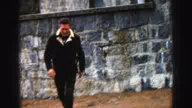 Lake Tahoe California (1969): People Walk By The Stone Building And Through The