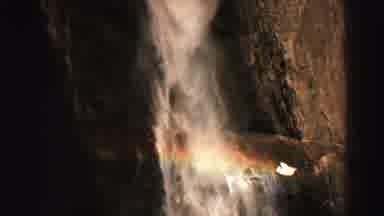 Lake Tahoe California (1969): White Waterfall Cascades Downward Over Jagged