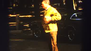 Lake Tahoe California (1969): Man Searches His Pockets For Something As Camera