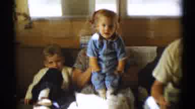 Disneyland California (1959): A Grandma And Grandpa Sitting On A Couch Holding A