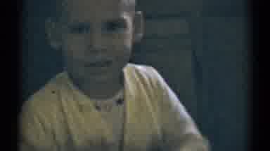 Disneyland California (1959): Youngster In Pajamas Plays Peekaboo And Then Sits In