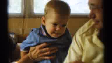 Disneyland California (1959): Baby Holding Onto Grandfather