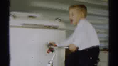 Disneyland California (1959): Boy Attempting To Ride A Bicycle Made For Young