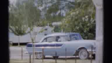 Disneyland California (1959): A Blue Classic Car Is Parked Somewhere, Followed By