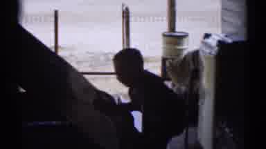 Disneyland California (1959): Child Climbs On The Thing That The Man Is Fixing Or
