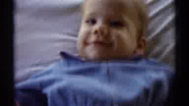 Disneyland California (1959): Blond Baby Lying On A Bed Smiling And Two Children