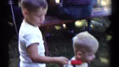 Disneyland California (1959): Child Plays At The Dog's Door Observed By His