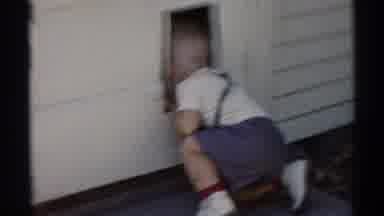 Disneyland California (1959): Young Boy Looking In Doggy Door