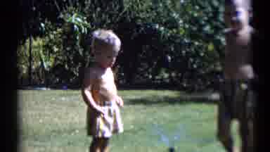 Disneyland California-1959: Little Boys Playing In Backyard With Sprinkler
