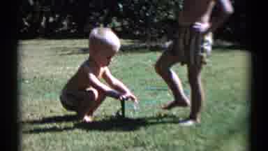 Disneyland California (1959): Two Boys Playing With The Water Sprinkler In The