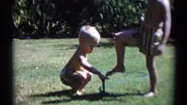 Disneyland California (1959): Two Little Boys In Swim Trucks Playing In A