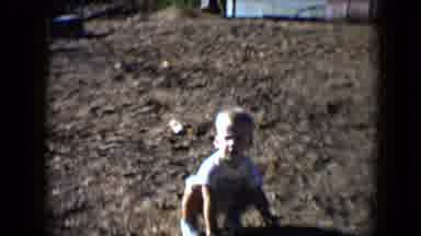 Disneyland California (1959): Baby Plays In The Dirt As The Dog Or Cat Walks Away