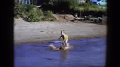 Disneyland California (1959): Two Children Playing In Lake On A Sunny Day