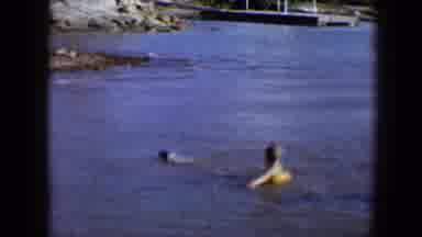 Disneyland California (1959): Dog And Boy Swimming In The Water