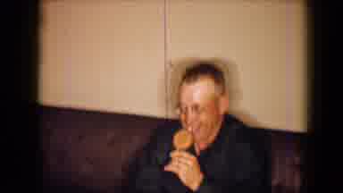 Disneyland California (1959): A Man Tries To Eat A Lolly On Camera While A Woman
