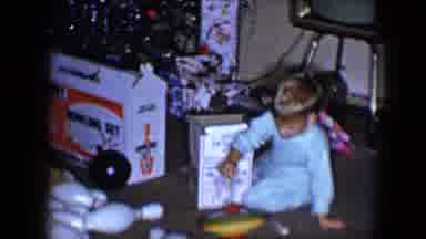 Disneyland California (1959): A Boy In Blue Pajamas Plays With A New Toy Spinning