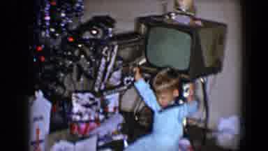 Disneyland California (1959): Young Boy In Pajamas Is Unwrapping Presents On
