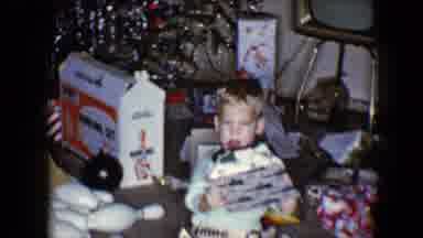 Disneyland California (1959): Child Kneeling On Floor Opening Up Present On
