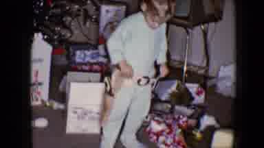 Disneyland California (1959): A Young Boy In Pajamas Plays With Two Toy Guns And A