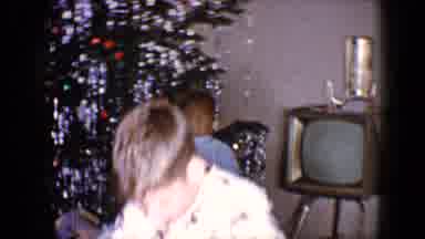 Disneyland California (1959): Two Children By Christmas Tree Opening Presents On