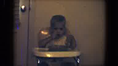 Disneyland California (1959): Baby In Highchair Eats Food By Himself And Smiles As