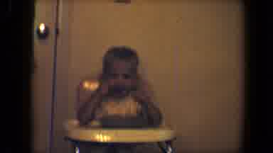 Disneyland California (1959): Small Child Sitting In High Chair Eating Food With A