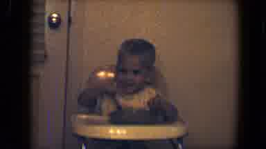 Disneyland California (1959): A Baby Sitting On A Dinning Table Is Eating Food In