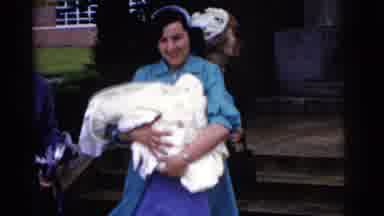 Gary Indiana USA-1961: Woman Carries Newborn Baby in Blankets Outside