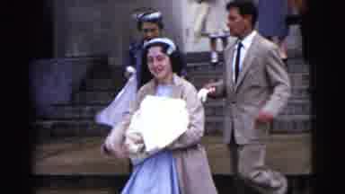 Gary Indiana USA-1961: A Smiling Woman Carries A Bundled Baby Down The Steps Of