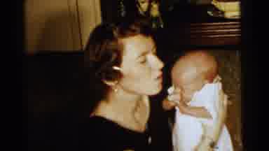 Gary Indiana USA (1961): Woman Kisses Newborn Baby Dressed In White On The Head