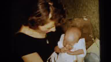 Gary Indiana USA (1961): Woman Holding Crying Newborn Baby In White Dress On Her