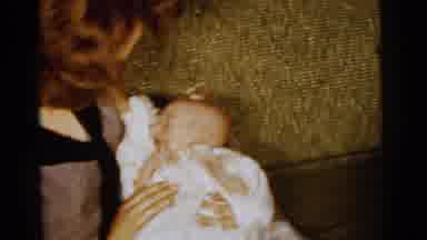 Gary Indiana USA (1961): Two Women Dress Two Babies In White And Try To Get Their