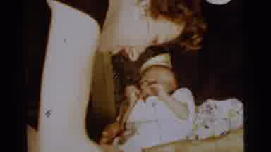Gary Indiana USA (1961): An Older Woman Fusses With And Cares For A Newborn Baby