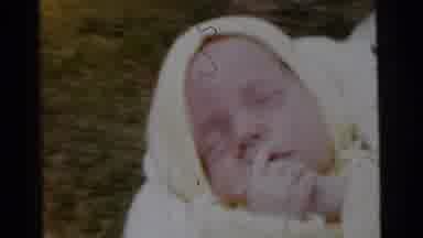 Gary Indiana USA (1961): An Older Woman Carries, Comforts, And Coddles A Young